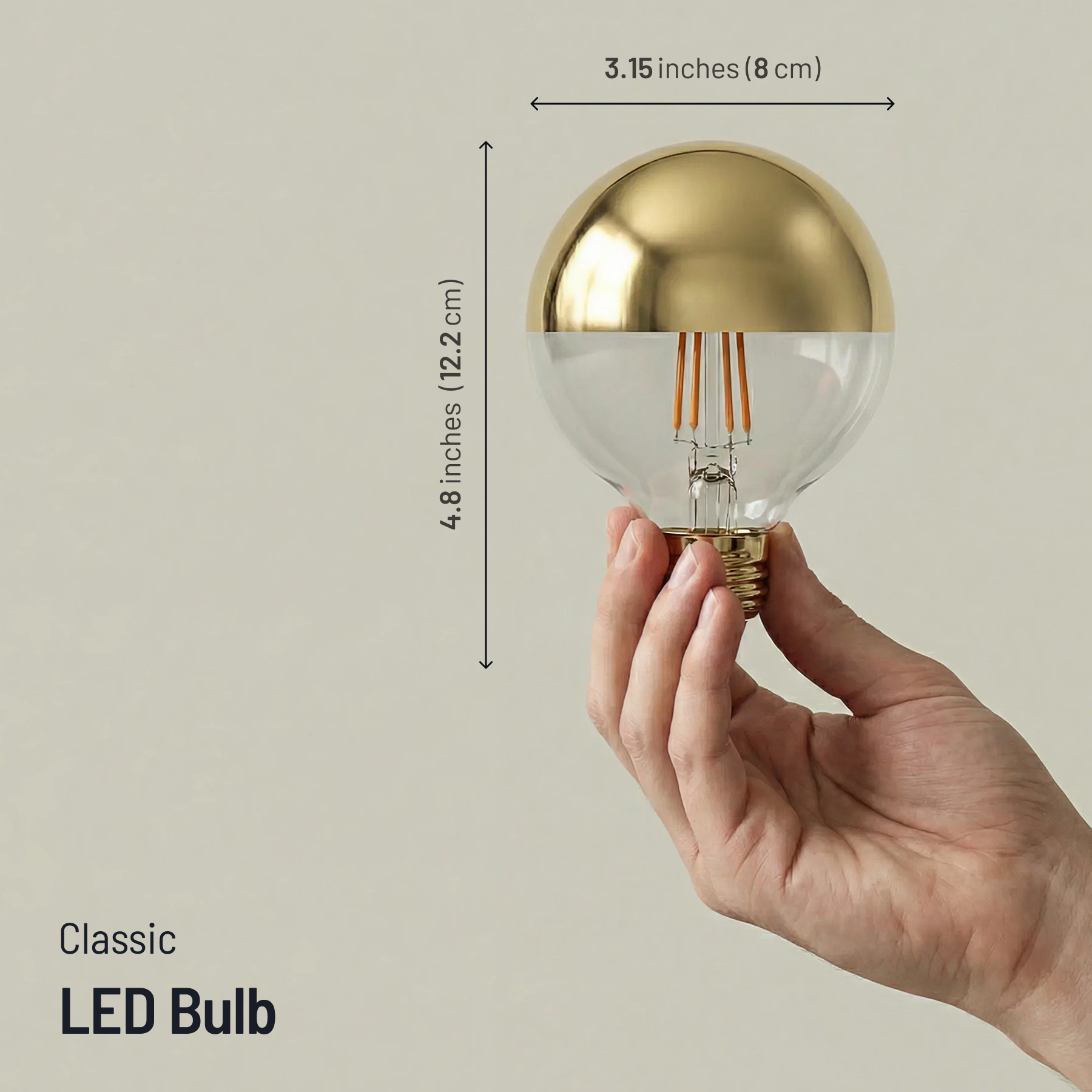 Hand holding a gold LED bulb with dimensions indicated on a beige background