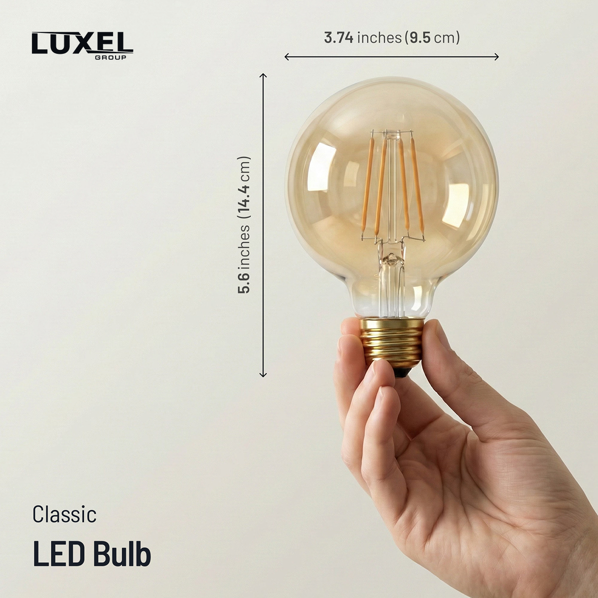 Hand holding a classic LED bulb with dimensions labeled, Luxel brand visible