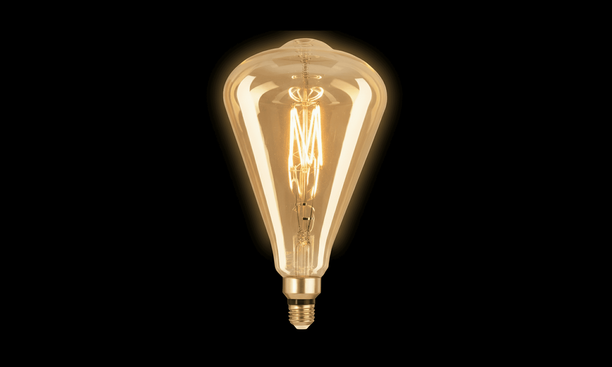Vintage-style light bulb on a black background