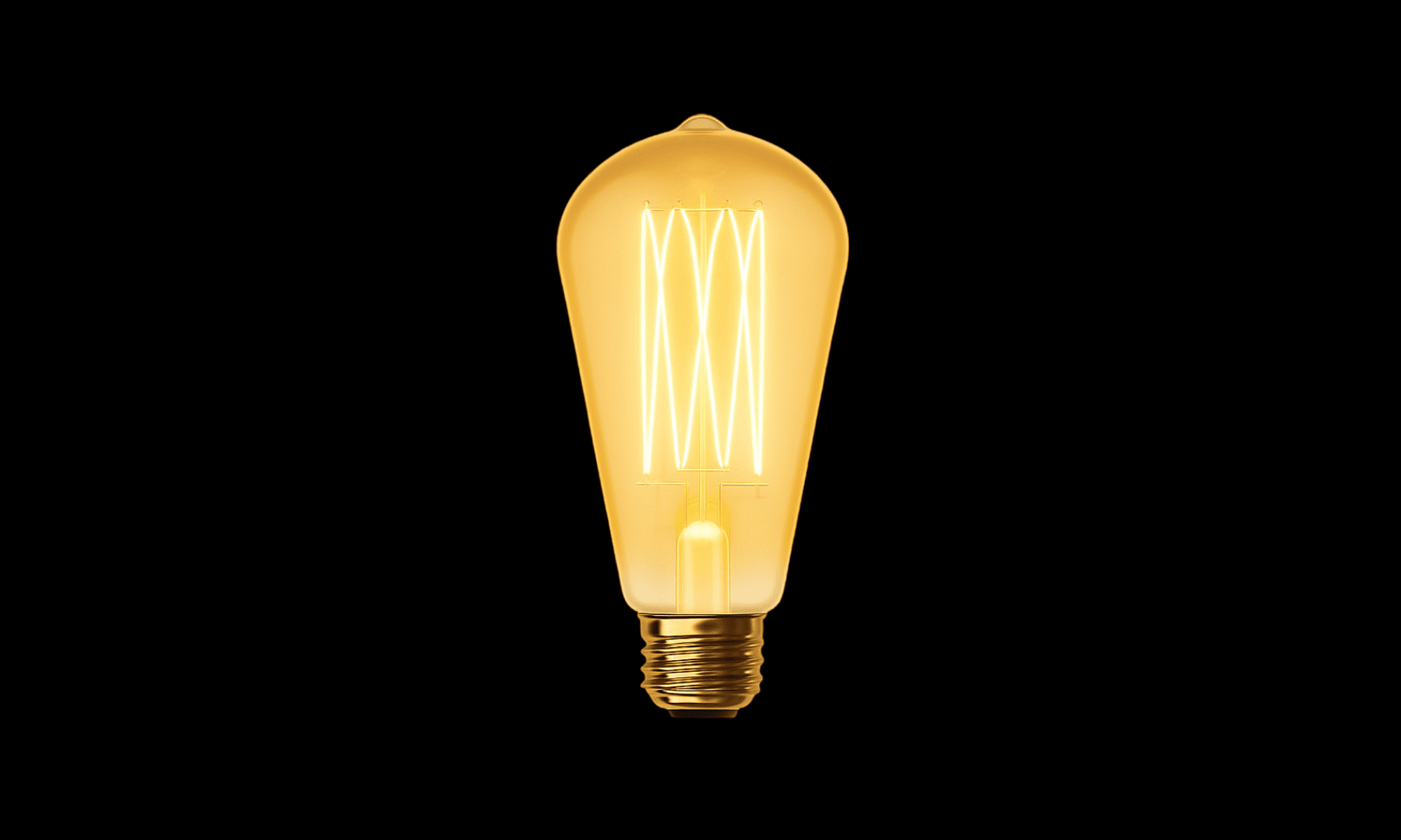Vintage-style light bulb on a black background